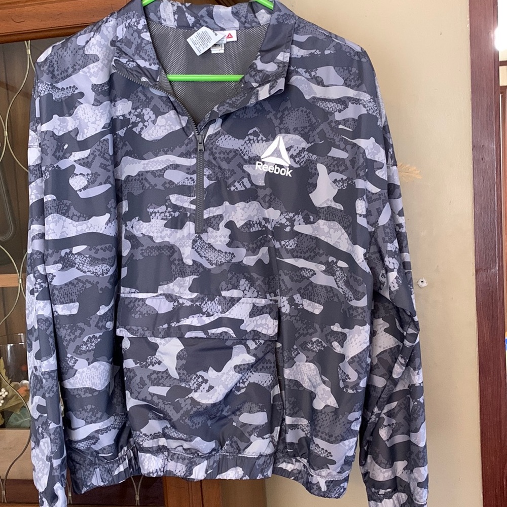 Woman’s gray windbreaker jacket size medium only wore one time